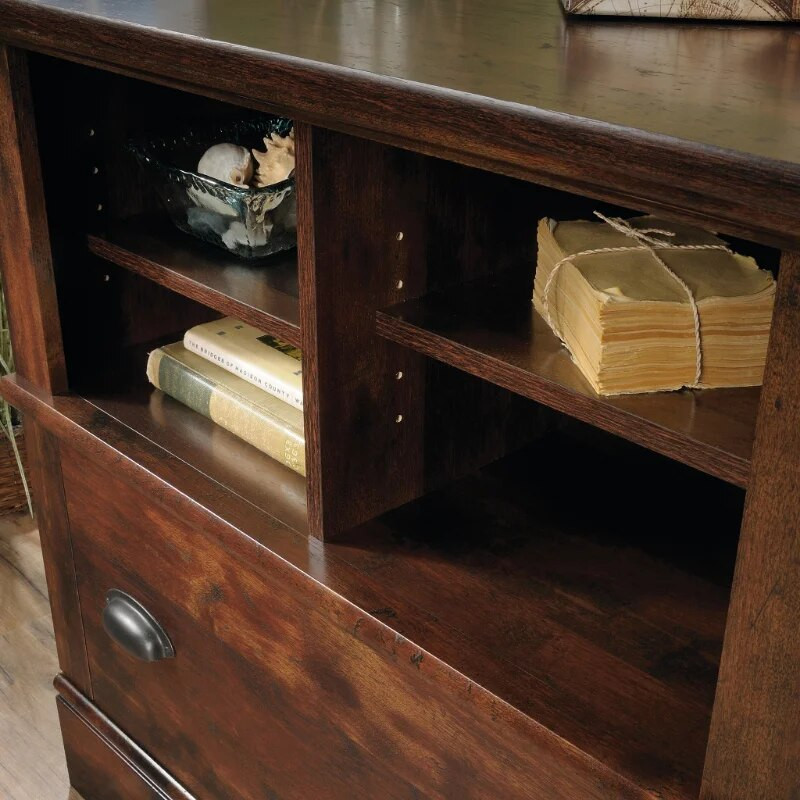 Close-up of cabinet interior with shelves and book bundles
